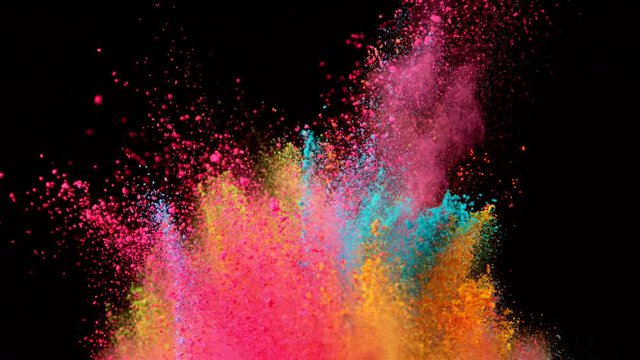 Super slowmotion shot of color powder explosions isolated on black background. Shot with high speed cinema camera at 1000fps