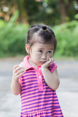 Close up Cute girl to act innocent wearing pink dress