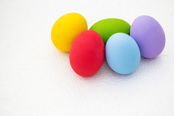 Colorful Easter eggs background. holiday, easter background. Colorful easter eggs on the green garden yard. symbol of easter's day festival. vivid color natural background. festive wallpaper.