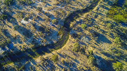 Aerial view of simple bush campsite at Khwai River near Moremi National Park, Botswana, Africa