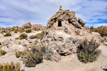 Ancient human remains buried in traditional Chullpas at the Necropolis of San Juan
