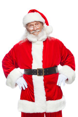 Christmas. Santa Claus put his hands on his belt. Isolated on white background.