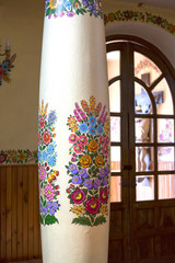 Painted column in church decorated with a hand painted colorful flowers, Zalipie, Poland