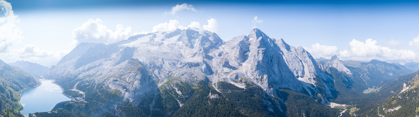 Fototapeta premium Panoramic view of the Marmolada and the Fedaia lake.
