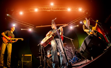 Obraz na płótnie Canvas Band performs on stage in a nightclub