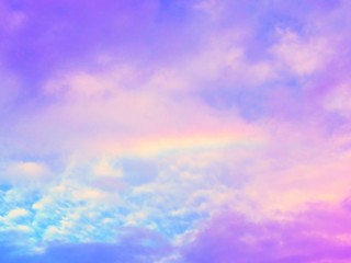Beautiful rainbow with cloudy sky background.