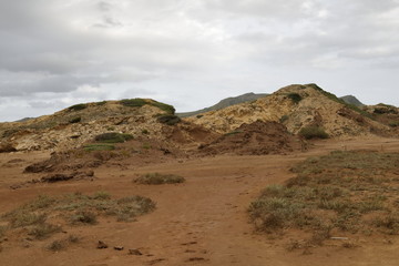 Fototapeta na wymiar Dry red landscape view near the coast of Menorca, Spain
