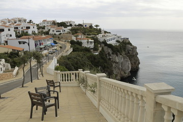View of houses on top of a cliff above the mediterranean sea
