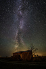 Fototapeta na wymiar The old garage and the Milky Way