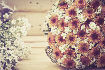 Flower bouquet on wooden table background,soft focus.