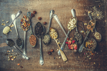 Assortment of dry tea in vintage spoons