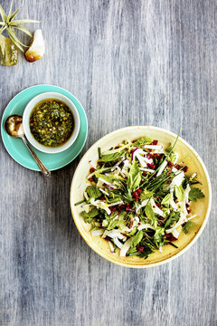 Fennel Herb Salad with Italian Style Salsa Verde. Photographed on a b;ack/grey background.