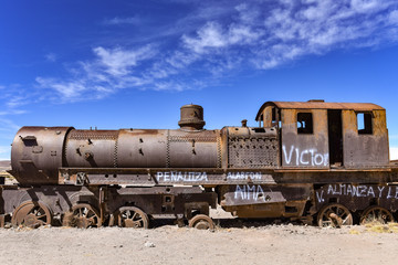 Fototapeta na wymiar Rusting locomotive engines in the Cemeterio de Trenes (Train Cemetery), Uyuni, Potosi department, Bolivia