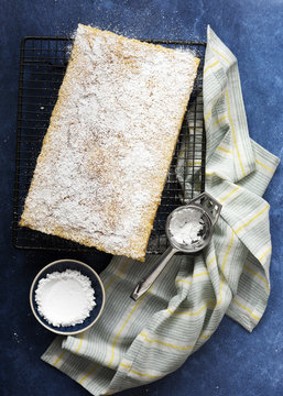 Homemade lemon slice covered with sifted icing powder.