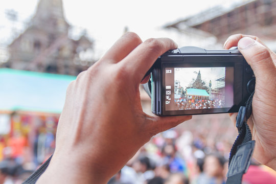 Unknown People Taking Photos with Digital Camera