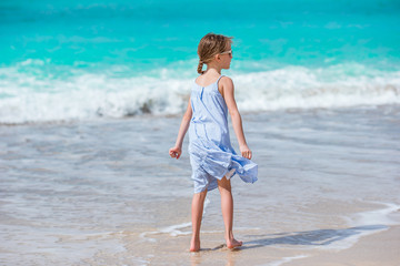 Fototapeta na wymiar Happy girl enjoy summer vacation on the beach