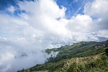 Naklejka premium Morning mist and mountain. Morning fog in the mountain. View nature mountain sky and fog.