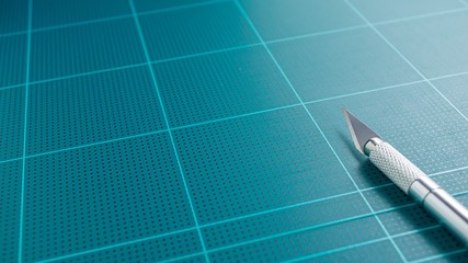 Close up picture of cutting mat and art knife