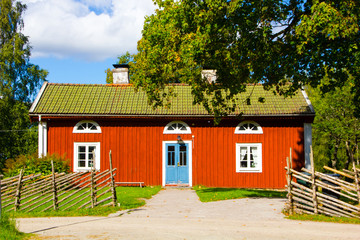 traditional Swedish red and white house or tiny cottage on the countryside 