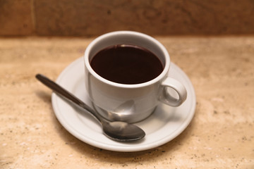 White cup of hot chocolate on wooden table
