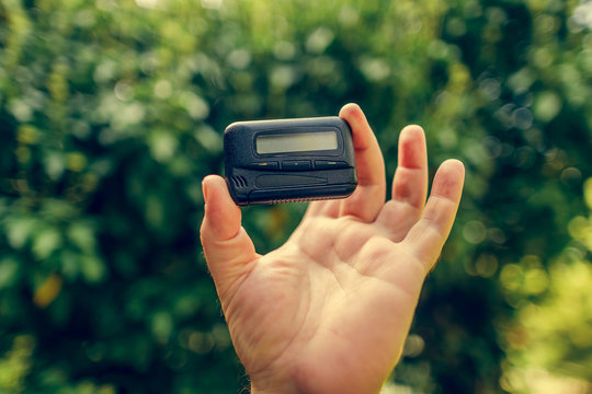 Pagers. Old Vintage Beeper. Pager In Hand