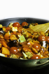 Braised zucchini, eggplant, hot pepper, tomato paste, bay leaf, carrot, tomatoes, and dill in pan...