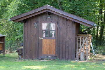 Brown old wooden summerhouse in the garden 