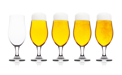 Cold glasses of lager ale beer with foam