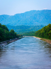 Obraz premium A canal for irrigation crops and drinking water is emerging from the river Ganga near Haridwar,Rishikesh, Uttarakhand, India.