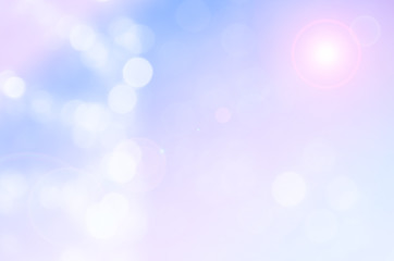 Fototapeta premium De-focused lights bokeh abstract on pink and blue background with lens flare