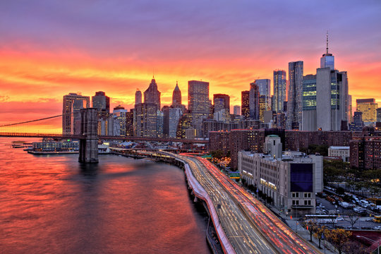 Fototapeta View of Lower Manhattan with Brooklyn Bridge at at Amazing Sunset, New York City