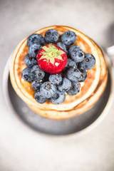 Blueberry and strawberry on pancakes