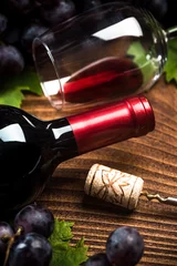 Gordijnen Bottle of red wine with corkscrew © marcin jucha