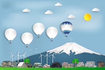 The hot air balloons travel over Fuji mountain in Japan and countryside on blue sky as trip in the holiday , paper art and craft style concept. vector illustration.