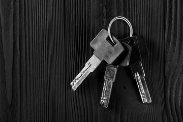 Old key on black wooden table