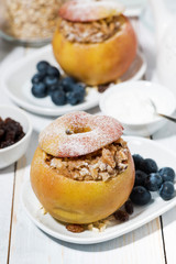 healthy breakfast. portioned oatmeal baked in apple, vertical top view