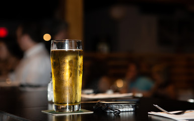 Glass of beer at a bar