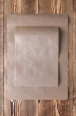 yellow kraft paper isolated on wooden background