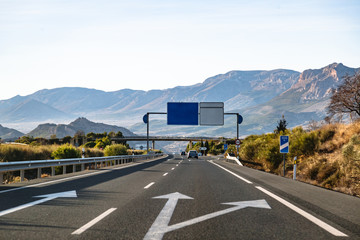 Spanish highway in front of mountains Sierra Nevada