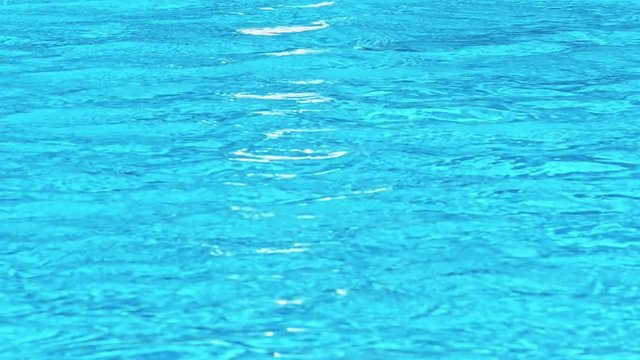 Surface of blue swimming pool