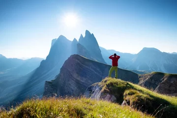 Tuinposter Climber on the high rocks background. Sport and active life concept. Adventure and travel in the mountain region in the Dolomites, Italy. © biletskiyevgeniy.com