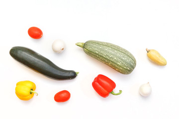 Ripe courgettes on white background top view