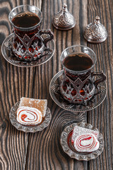 Fragrant Turkish tea and Turkish sweets in national dishes