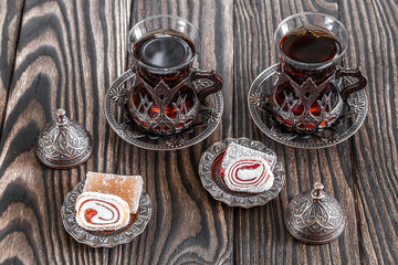 Fragrant Turkish tea and Turkish sweets in national dishes