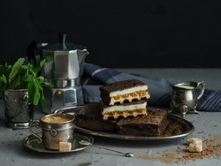 Coffee still life with chocolate cakes.