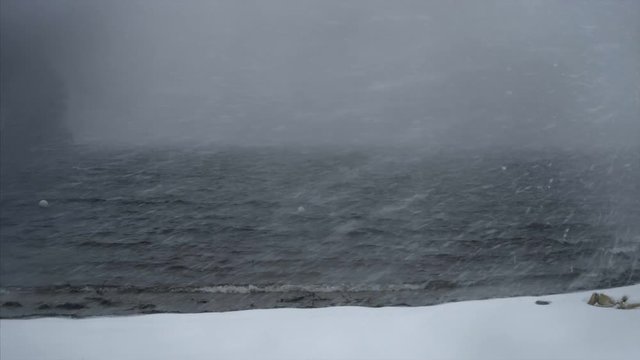Snow Falling on Lake