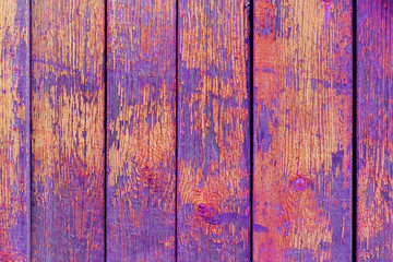 Grunge background. Purple and orange paint on wood