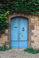 Blue wood door in a french village