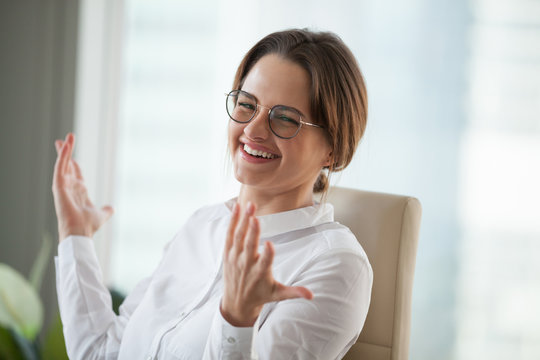 Happy Young Businesswoman Having Fun Looking At Camera In Office, Smiling Woman Employee Laughing Enjoying Funny Humor Or Stress Free Job, Positive Life Coach Or Psychologist Head Shot Portrait