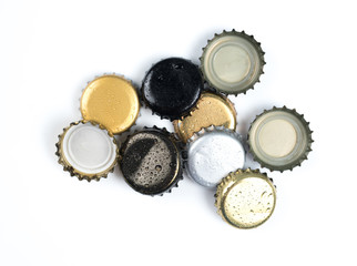 Beer bottle caps on white background